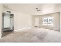 Bright and spacious living room with neutral walls and carpet at 1230 Peoria St, Aurora, CO 80011