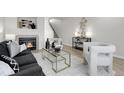 Stylish living room featuring a fireplace, contemporary furniture, and chic accents at 1888 Oakcrest Cir, Castle Rock, CO 80104