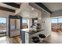 Gourmet kitchen featuring a breakfast bar and stunning city views at 130 N Pearl St # 1101, Denver, CO 80203