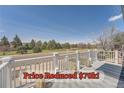 Scenic balcony view overlooking lush greenery, a calming sight for relaxation at 4090 S Tamarac Dr, Denver, CO 80237