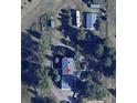 An aerial view showing the home and surrounding acreage with mature trees on the property at 2879 Gold Creek Dr, Elizabeth, CO 80107