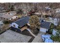 Beautiful aerial view of the home featuring landscaping, backyard, and a detached two-car garage at 3318 S Dayton Ct, Denver, CO 80231