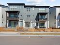 Contemporary townhome exterior showcasing stylish architecture, private balconies, and street view at 2721 W 167Th Pl, Broomfield, CO 80023