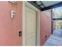Close-up of a white door with a doorbell and the letter 'F' next to it at 3040 Zuni St # F, Denver, CO 80211