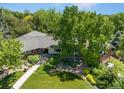Aerial shot showcasing the home's lush surroundings, mature trees, and beautiful landscaping at 3980 S Dexter St, Cherry Hills Village, CO 80113