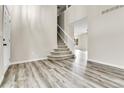 Inviting living room with staircase, wood floors, and neutral paint, perfect for modern living at 22974 E Dorado Dr, Aurora, CO 80015