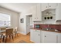 Charming kitchen with vintage cabinets, a dining nook, and natural lighting at 2345 S Williams St, Denver, CO 80210