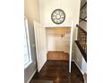 Coat closet off front entrance with custom shelving offers ample storage space at 21580 Longs Peak Ln, Parker, CO 80138