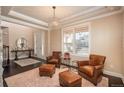 Comfortable seating arrangement in a well-lit living room at 22435 Boundstone Dr, Parker, CO 80138
