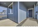 The covered porch welcomes you to the front door of this beautiful home at 735 Sunflower Dr, Brighton, CO 80601