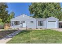 Charming single story home with a well-manicured lawn and attached garage at 4727 E Bails Pl, Denver, CO 80222