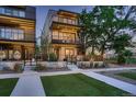 Modern home exterior showcases multi-level balconies and a landscaped front yard at 3232 W 16 Ave, Denver, CO 80204