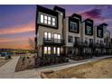 Modern townhome exterior with balconies showcasing contemporary design and inviting curb appeal at 2329 Lakeshore Ln # 14, Superior, CO 80027
