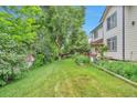 Well-maintained backyard featuring a lawn and garden, perfect for outdoor relaxation and gardening enthusiasts at 18852 E Progress Ave, Centennial, CO 80015