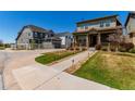View of home with manicured lawn and walkway leading to inviting covered porch at 24043 E Florida Ave, Aurora, CO 80018