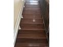 Elegant staircase with modern wood-style floors at 4320 Nepal St, Denver, CO 80249