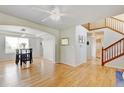 Bright living room featuring hardwood floors and open layout at 2588 E 116Th Ave, Thornton, CO 80233