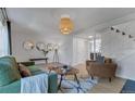 Well-lit living room with comfortable seating, a fireplace, and stylish accents for a welcoming feel at 9424 E Girard Ave, Denver, CO 80231