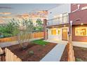 Inviting home features a well-manicured front yard, walkway, and appealing facade with a cozy entrance at 1046 N Knox Ct, Denver, CO 80204