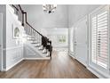 Bright foyer with wood floors, high ceilings, a staircase and direct access to the main living space at 5441 S Dayton Ct, Greenwood Village, CO 80111