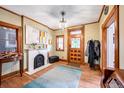 Classic foyer with hardwood floors, a fireplace, a stained glass door, and traditional decor at 231 N Sherman St, Denver, CO 80203