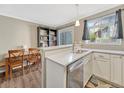 Bright kitchen with stainless steel appliances, white cabinetry, and quartz countertops provides a modern cooking space at 17427 E Rice Cir # C, Aurora, CO 80015