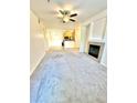 Open concept living room with views into kitchen and dining area at 17346 Nature Walk Trail # 105, Parker, CO 80134