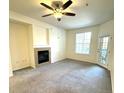 Spacious living room with fireplace and access to balcony at 17346 Nature Walk Trail # 105, Parker, CO 80134