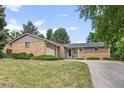 Beautiful home featuring a well-maintained lawn and an attached garage, perfect for suburban living at 888 E Davies Ave, Centennial, CO 80122