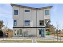 Contemporary three-story building with blue door at 1682 Tabor St, Lakewood, CO 80215