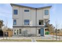 Modern home boasting clean architectural lines, stone accents, and contemporary windows at 1682 Tabor St, Lakewood, CO 80215