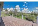 Spacious wooden deck with white railings overlooks a beautiful green landscape at 15805 W 14Th Pl, Golden, CO 80401