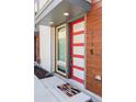Stylish front door with a vibrant color, enhancing curb appeal and highlighting modern design elements at 879 Delaware St, Denver, CO 80204