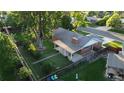 Aerial view of home with spacious yard, mature trees and a covered back patio with furniture at 820 Cottonwood Ave, Centennial, CO 80121