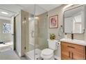Updated bathroom with a glass-enclosed shower, modern vanity, and stylish fixtures at 1820 Newland Ct # 201, Lakewood, CO 80214