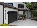 Charming exterior of home featuring detailed design elements and an attached garage with private driveway at 5516 S Havana Ct, Englewood, CO 80111