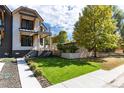 Front yard view of a modern home with landscaping and a walkway at 2478 S Lafayette St, Denver, CO 80210