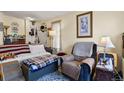 Cozy living room featuring neutral walls, plush seating, and natural light at 17034 E Tennessee Dr # 106, Aurora, CO 80017