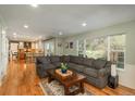 Open-concept layout showcases a generous living room connected to a kitchen and dining space at 7169 S Grape Ln, Centennial, CO 80122