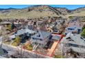 Aerial view of property showcasing its location with mountain views, landscaping and neighborhood at 4921 Fountain St, Boulder, CO 80304