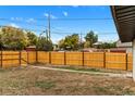 Spacious backyard with a wooden fence and potential for outdoor entertaining and recreation at 3220 W 8Th Ave, Denver, CO 80204