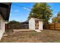 Backyard featuring a shed with deck and wooden fence at 3220 W 8Th Ave, Denver, CO 80204