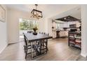 Open concept dining and kitchen area with sliding glass door to back deck at 3235 S Newland St, Denver, CO 80227