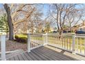 Cozy front porch with stylish railing, perfect for enjoying neighborhood views and relaxing outdoors at 8462 Everett Way # B, Arvada, CO 80005