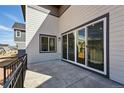 Outdoor patio with sliding glass doors, offering a smooth transition to indoor living at 7279 Prairie Sage Pl, Littleton, CO 80125