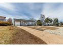 Inviting home with a well-kept lawn and attached garage, perfect for comfortable living at 3041 S Glencoe St, Denver, CO 80222