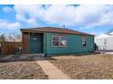 Inviting single-story home with a covered porch and well-maintained front yard at 1730 W 51St Ave, Denver, CO 80221