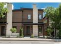 Beautiful home featuring a wood facade, stone accents, front porch, and manicured landscaping at 21 Washington Ave, Golden, CO 80403