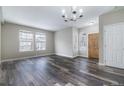 Bright and spacious living room features with dark wood-look floors and lots of natural light at 9758 Laredo St # 30E, Commerce City, CO 80022