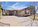 Attractive single Gathering home with stone and siding, set on a landscaped lot with a long driveway at 7370 S Catawba Way, Aurora, CO 80016